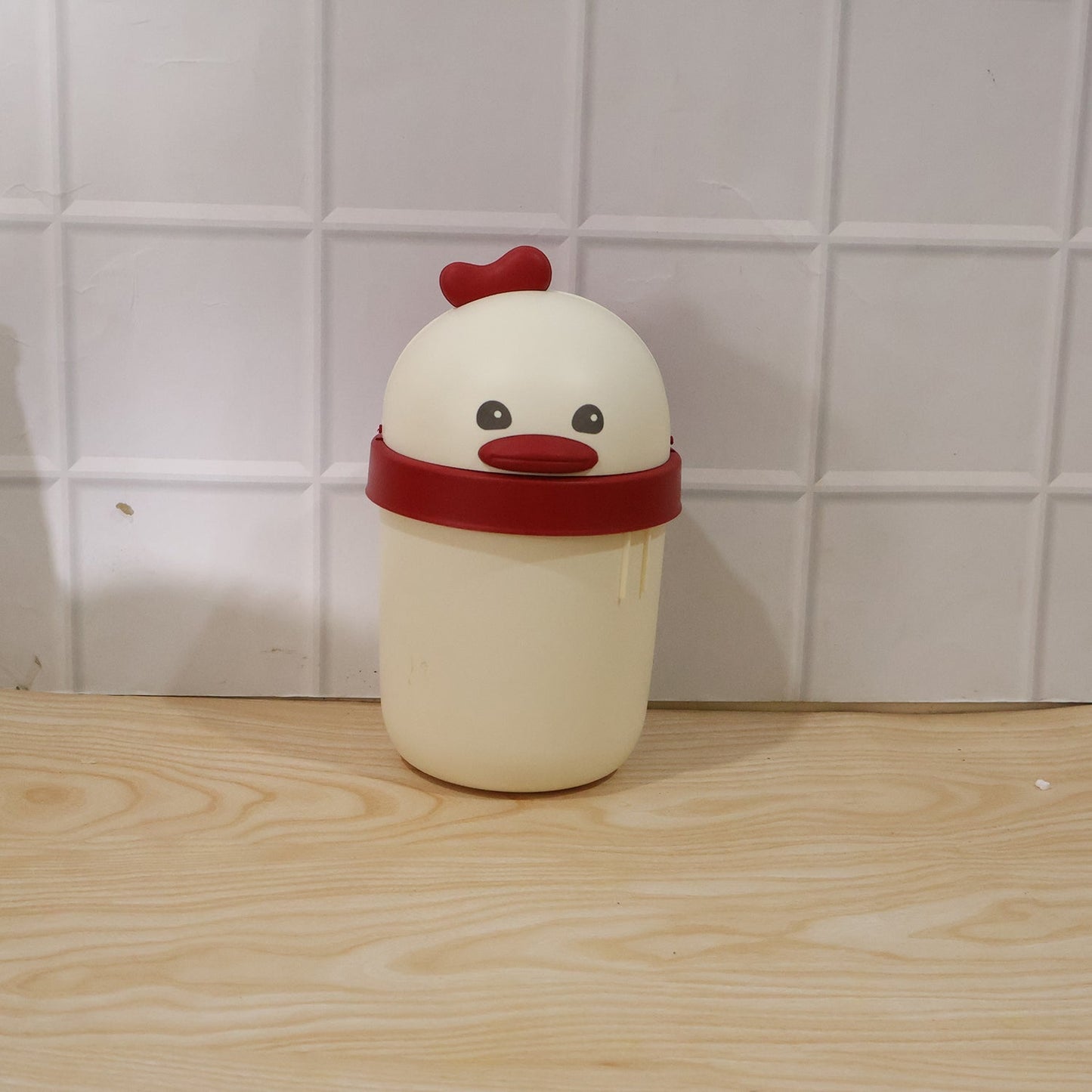 Box of mini desktop trash cans in chick design