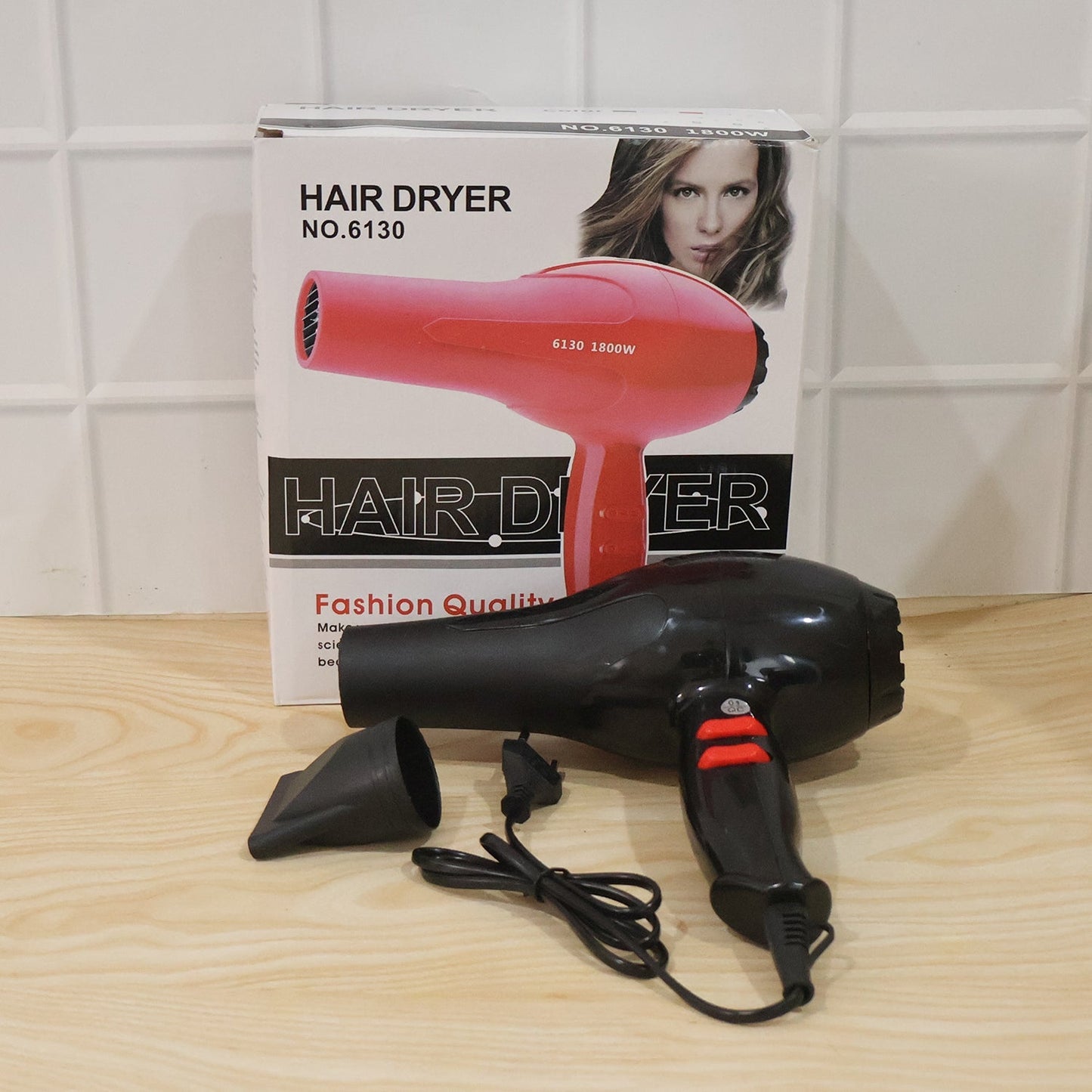 The portable hair dryer neatly packed in its product box.