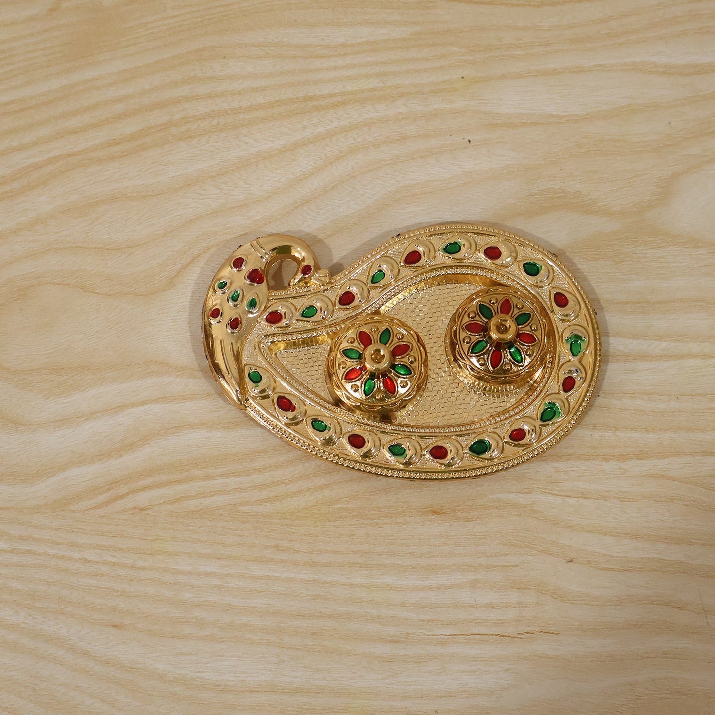 Golden Kumkum holder in its retail packaging