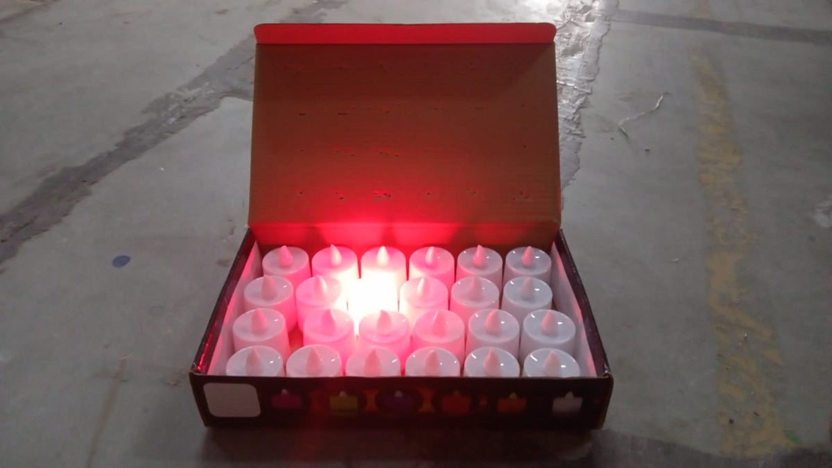 Red LED flameless tealight candles glowing warmly indoors for festive dΓ©cor