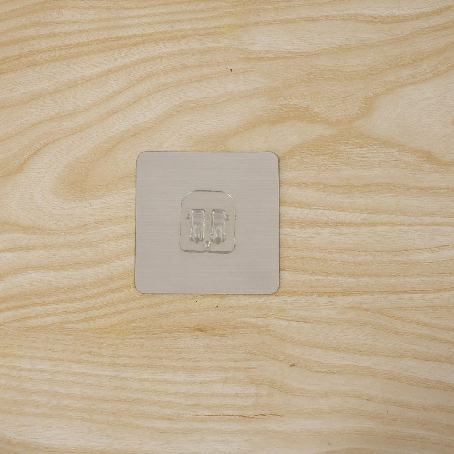Daily use of adhesive wall hook in home or office