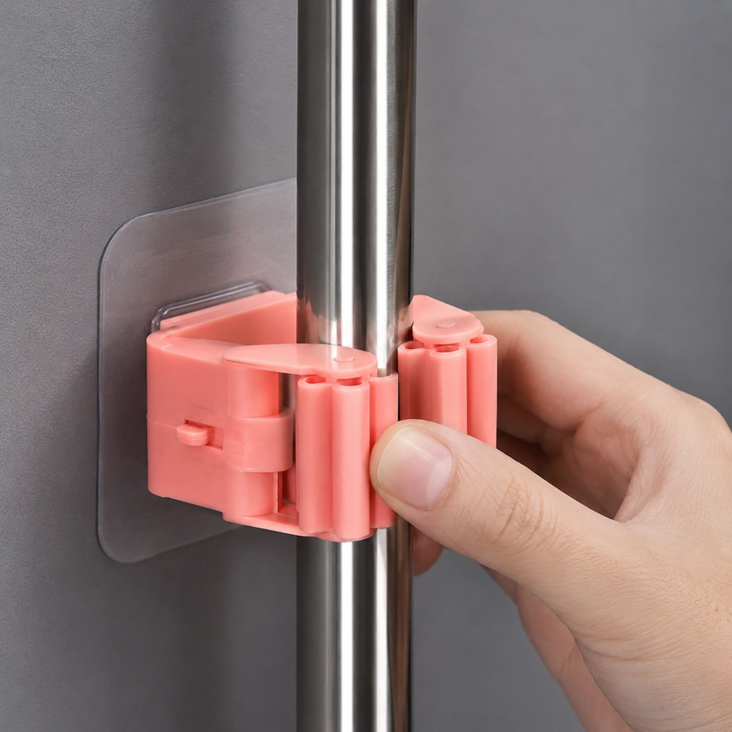 Wall-mounted mop and broom holder for organized storage