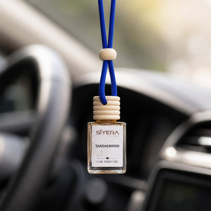 Elegant glass bottle of Sandalwood Car Perfume with a natural wooden cap and hanging cord.