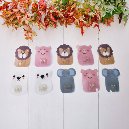 Fun and colorful cartoon hooks mounted on the wall for kids' playroom