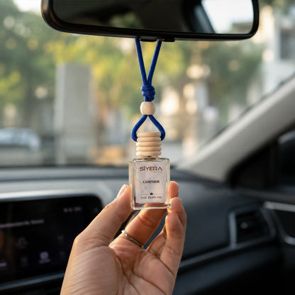 Detailed view of wooden cap on car perfume bottle