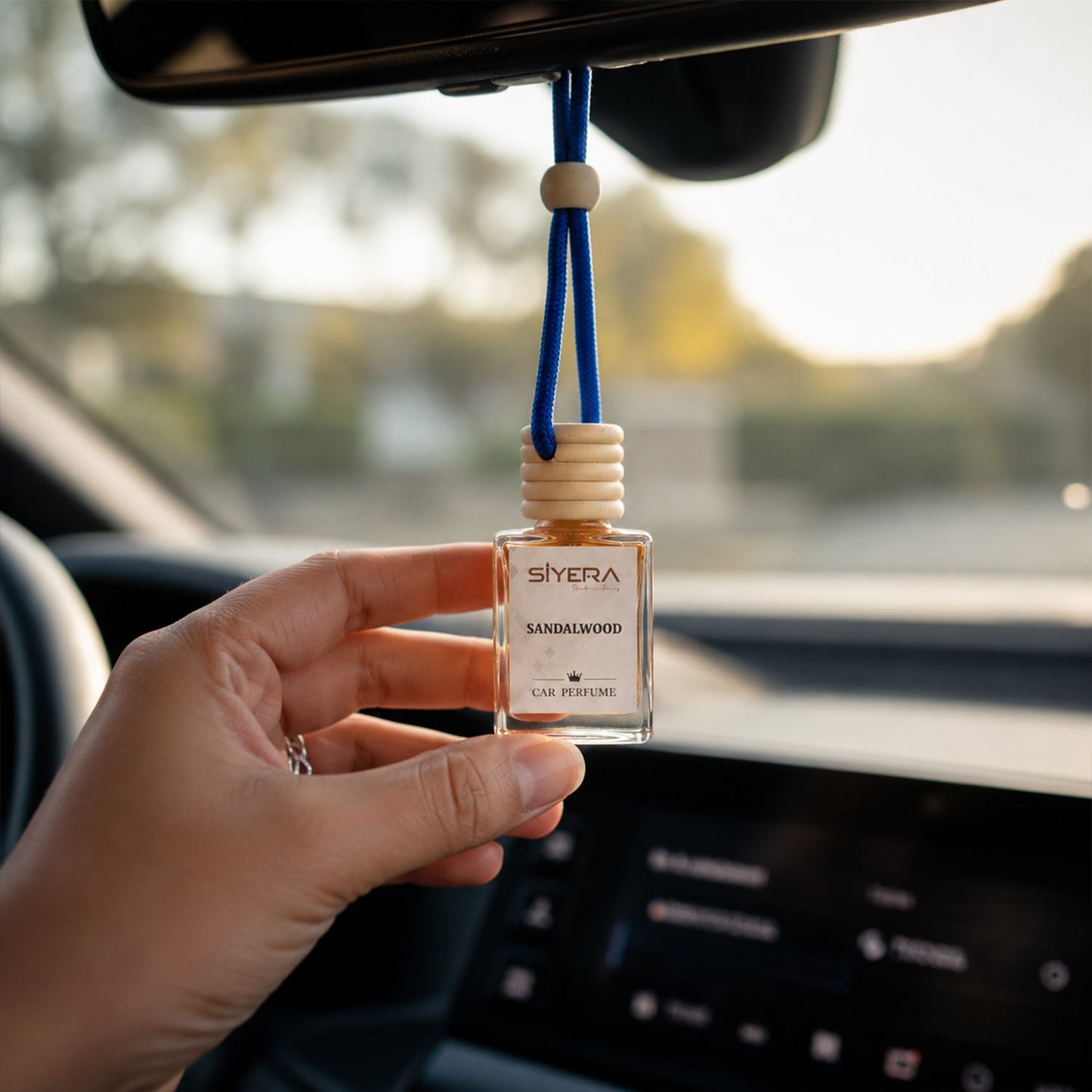 Close-up of the natural wooden cap on Siyera Sandalwood Car Perfume bottle.