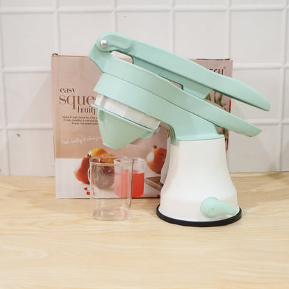 Side profile of manual citrus juicer on counter