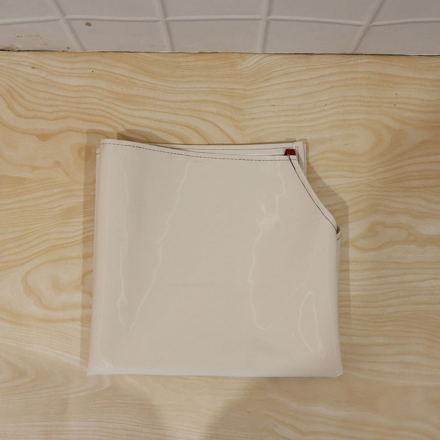 Person wearing waterproof apron while cooking in kitchen