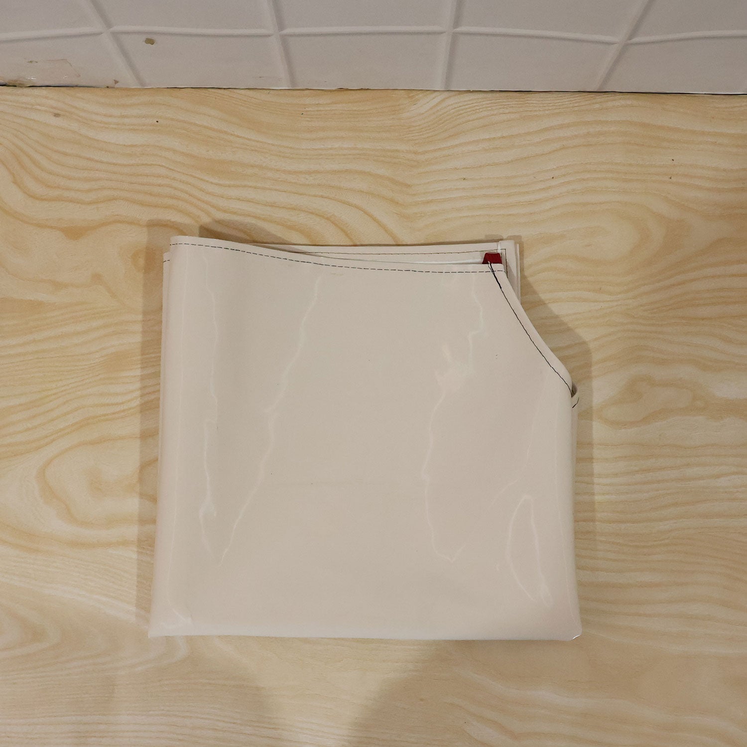 Person wearing waterproof apron while cooking in kitchen