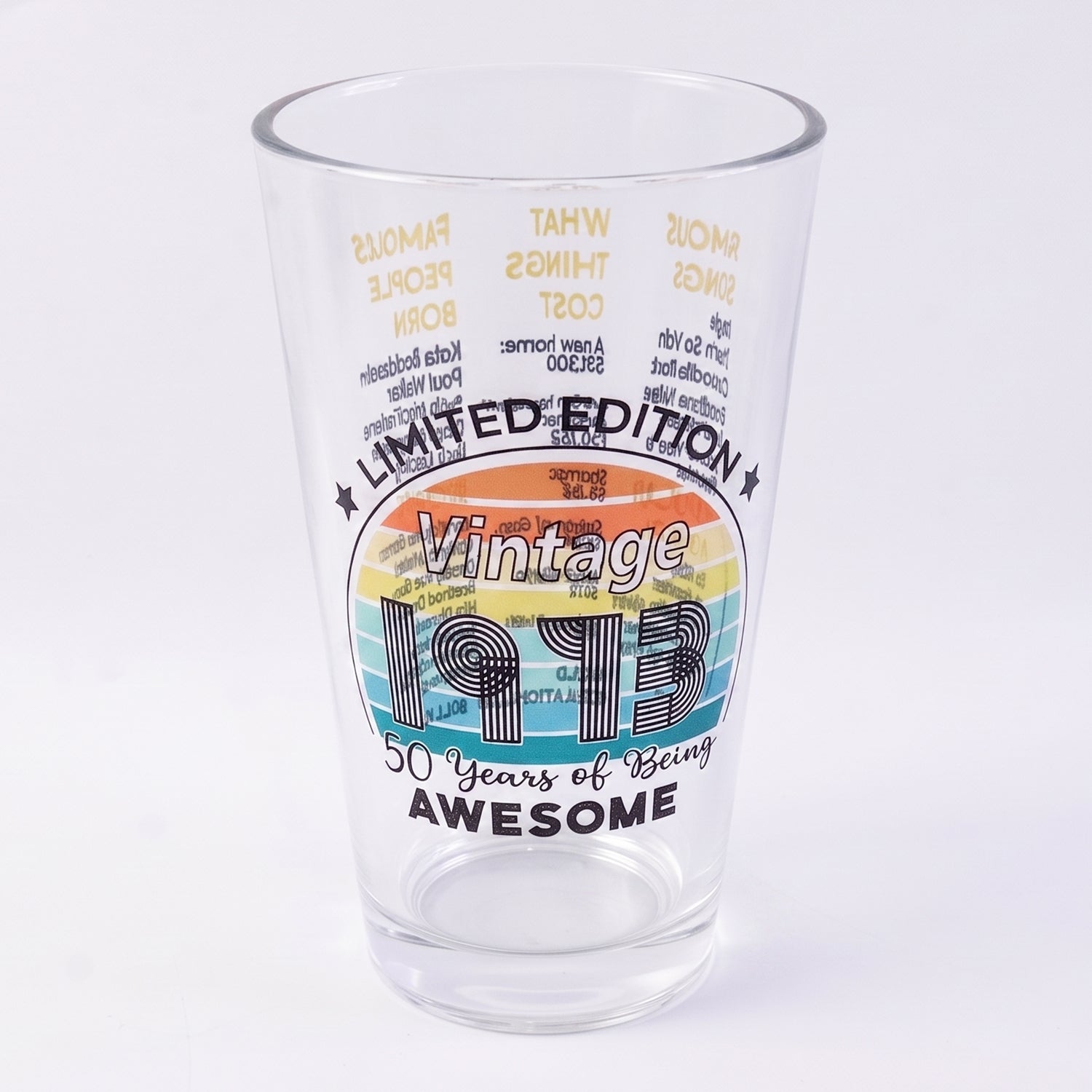 Transparent glass tumbler with trivia print on white background