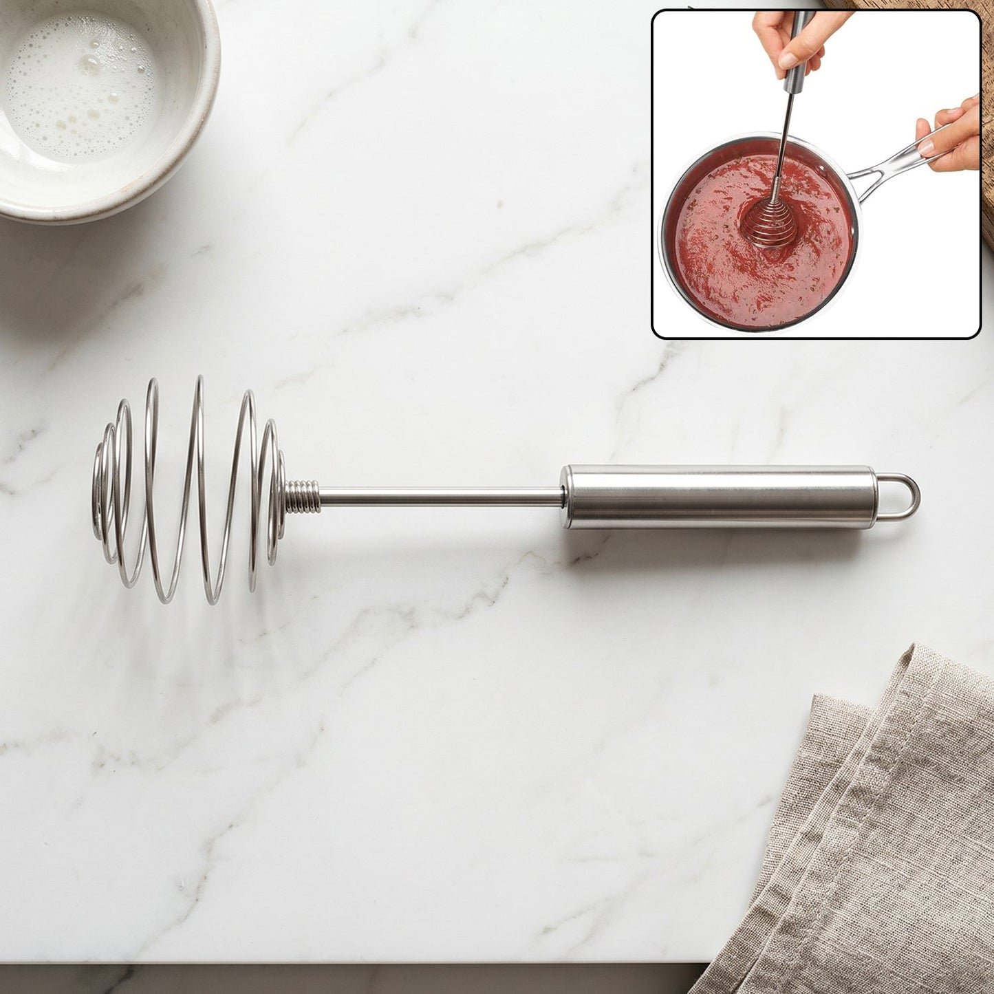 Steel whisk for eggs and cream mixing in kitchen