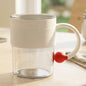 Transparent plastic tea and coffee mug with ring handle and red accent