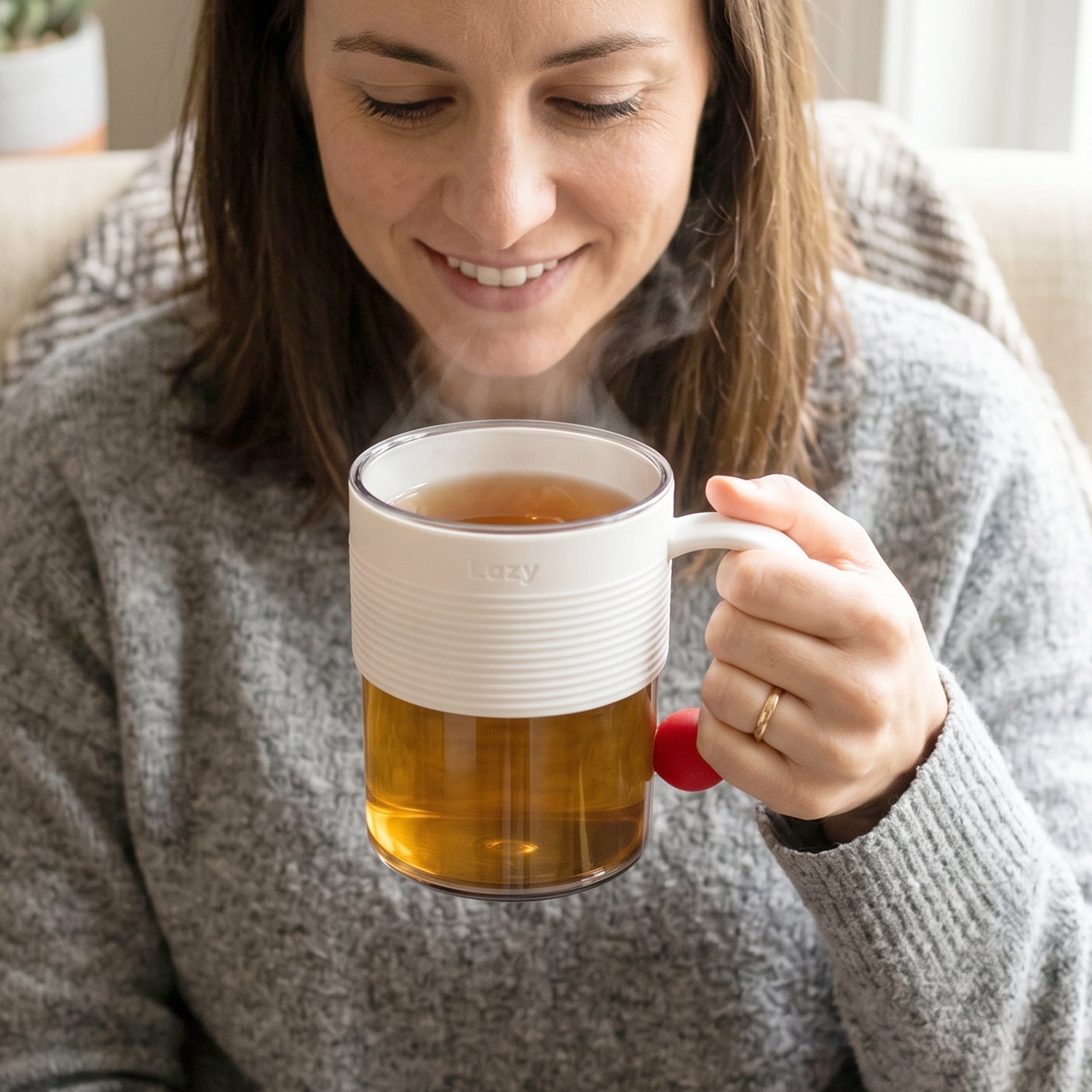 Transparent mug being used for drinking beverages
