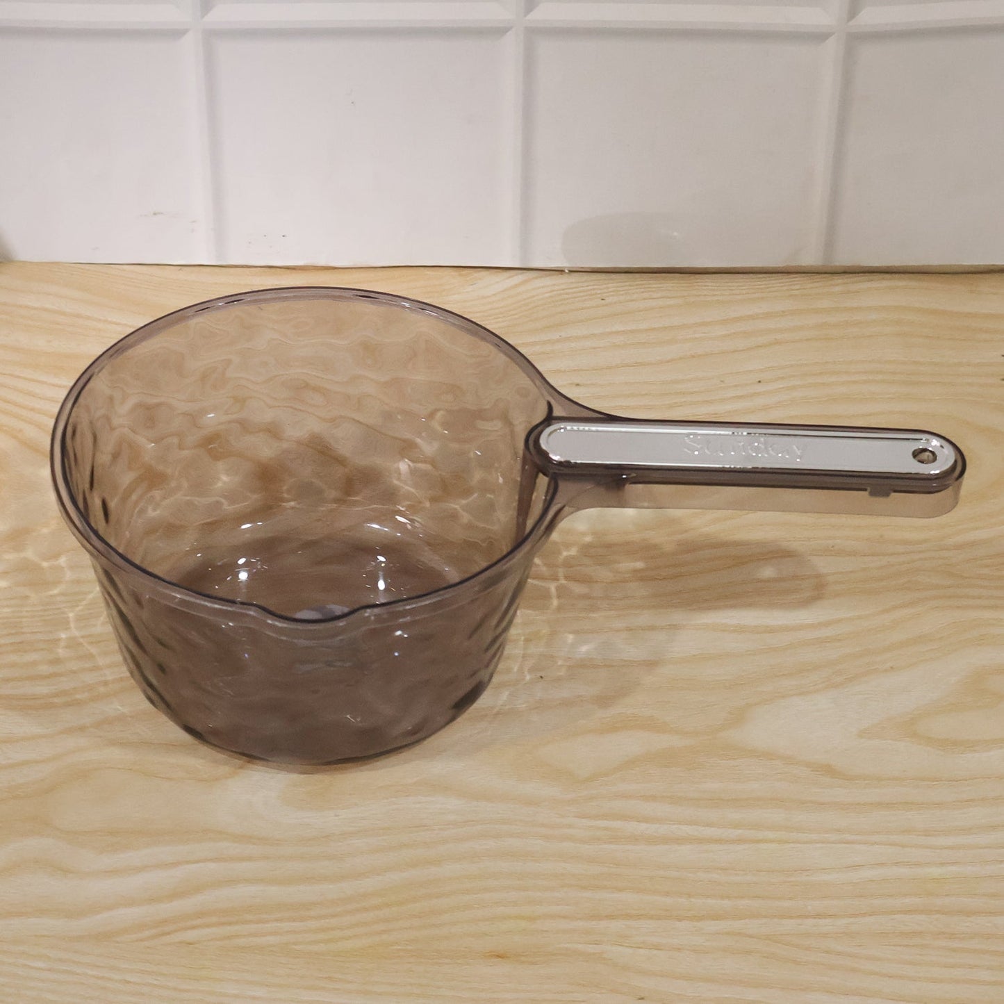 Daily household use of water dipper scoop for various tasks