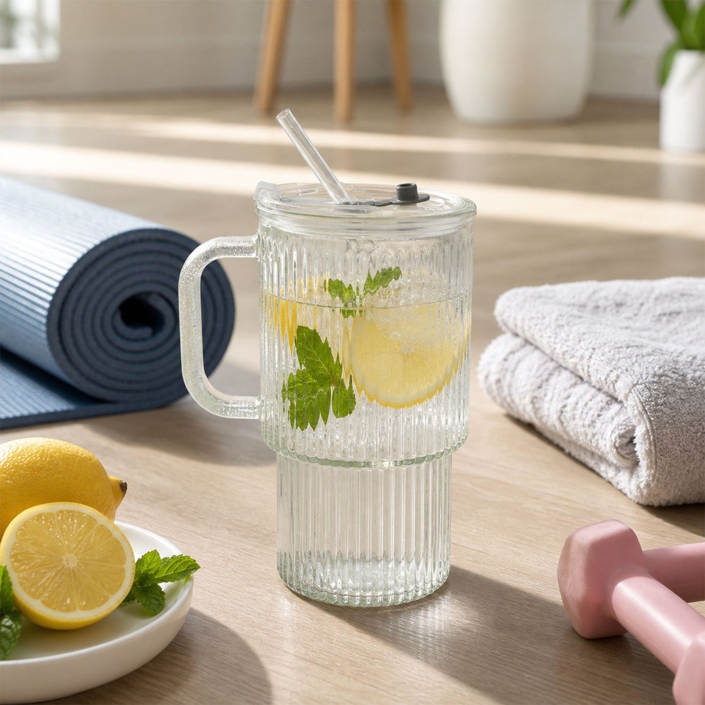 Glass tumbler in use for drinking cold beverage