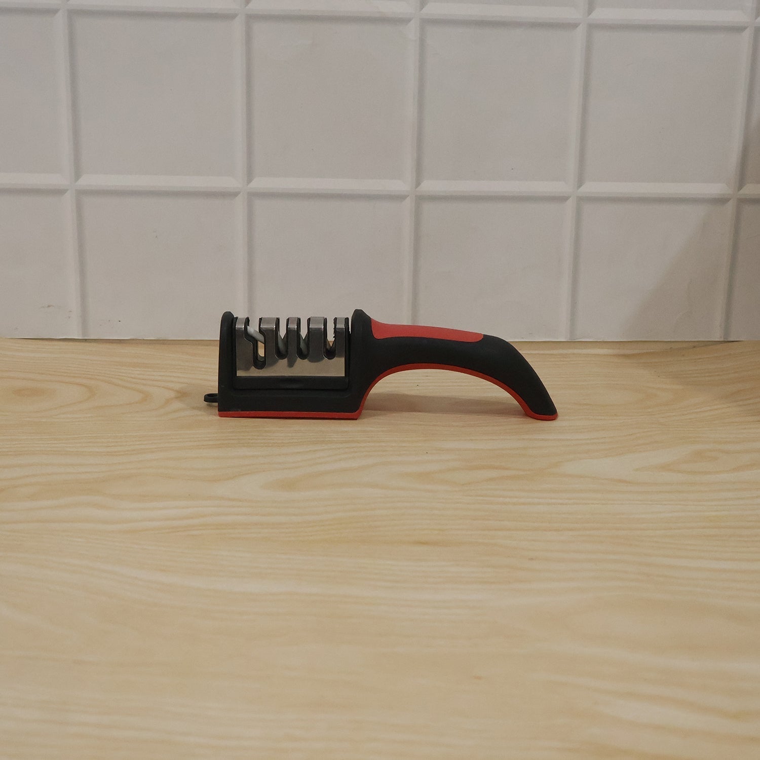 Close-up showing the four sharpening stages of the knife sharpener