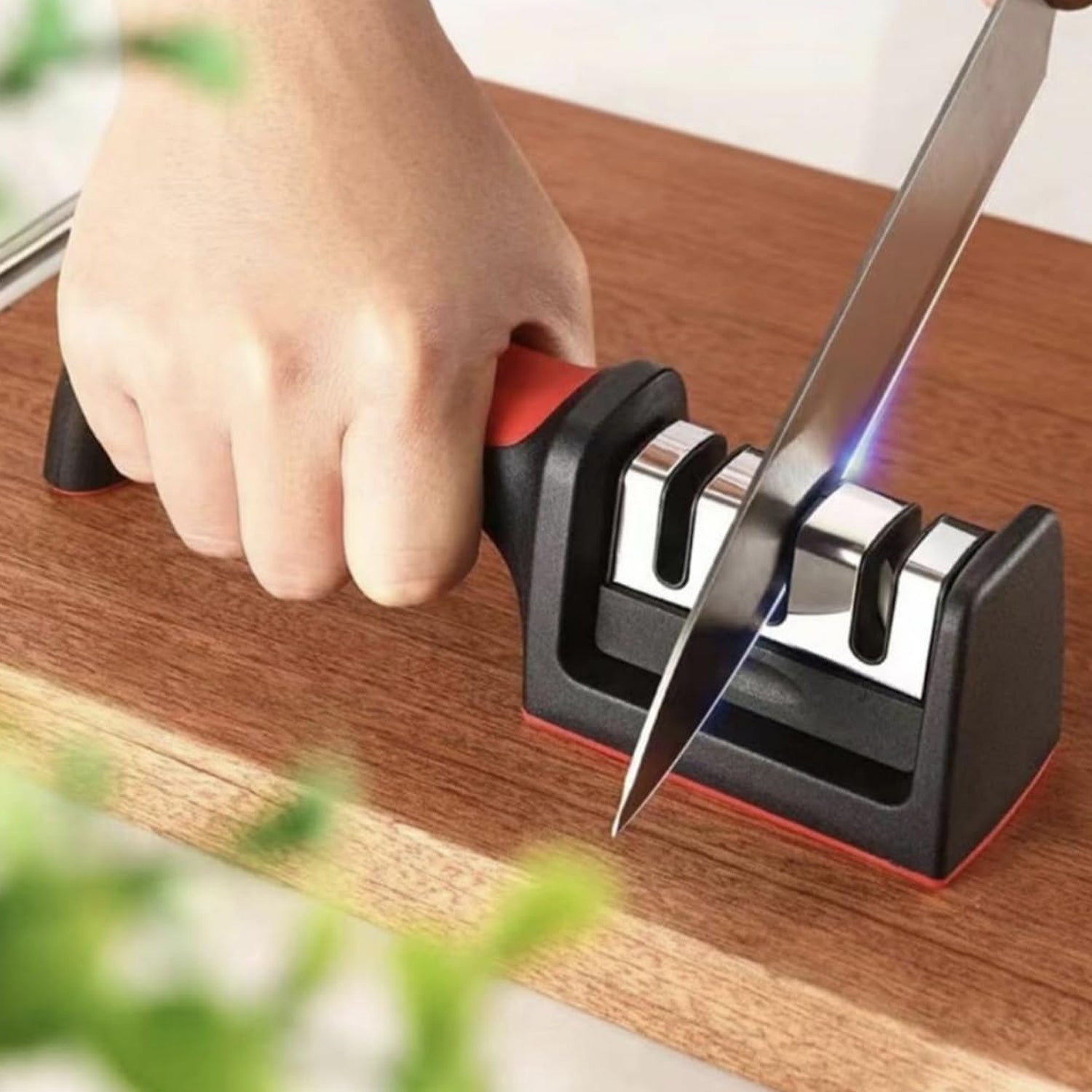 Kitchen knife being sharpened with 4-stage tool in use