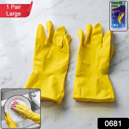 Pair of large yellow dishwashing gloves for kitchen jobs