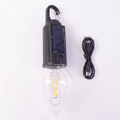Close-up of vintage warm LED filament bulb in camping lantern