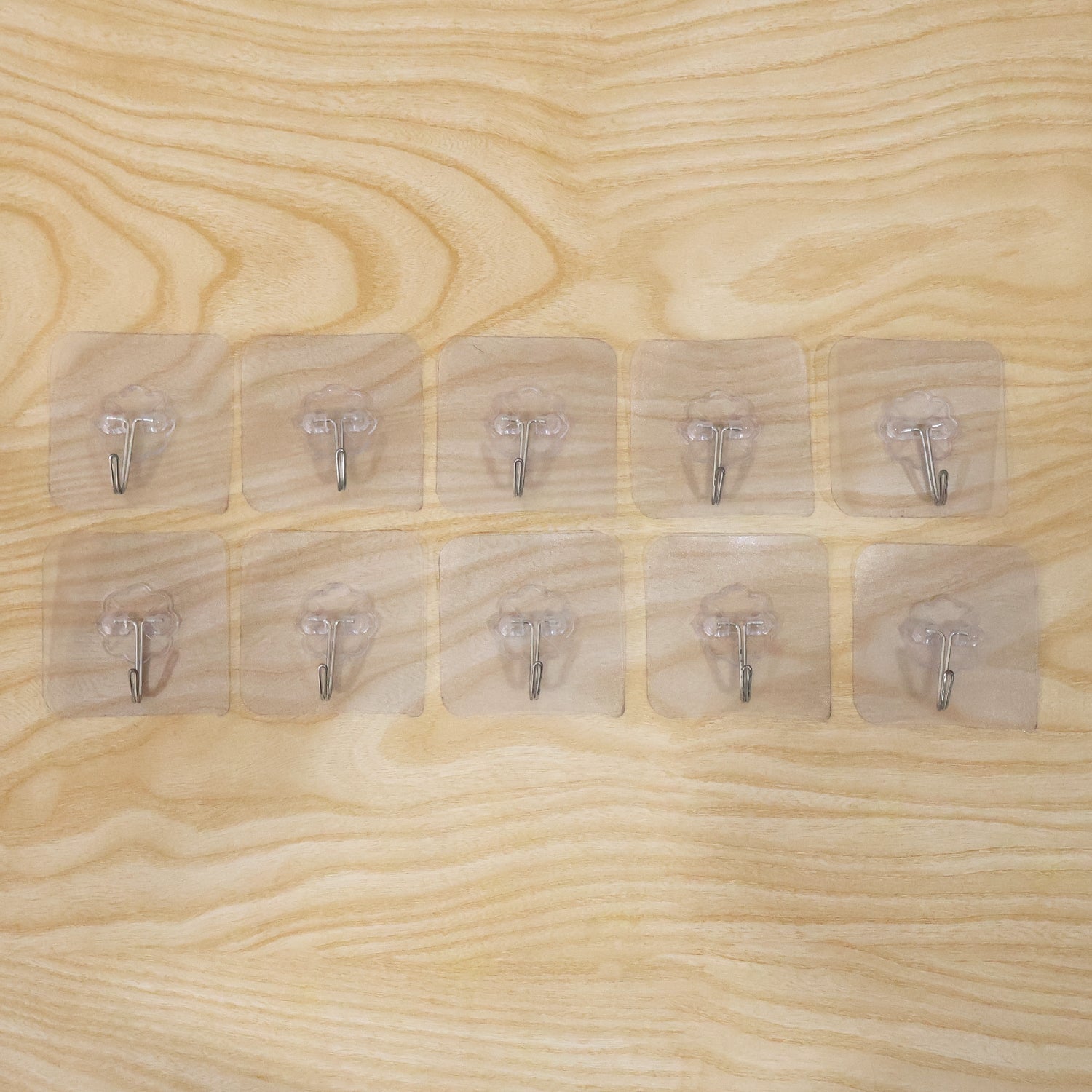 Adhesive wall hooks displayed for daily use