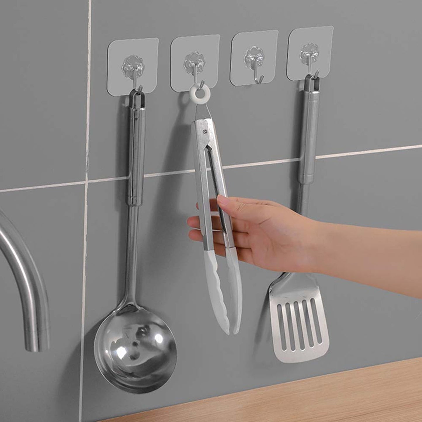 Wall hooks being used to hang items in home