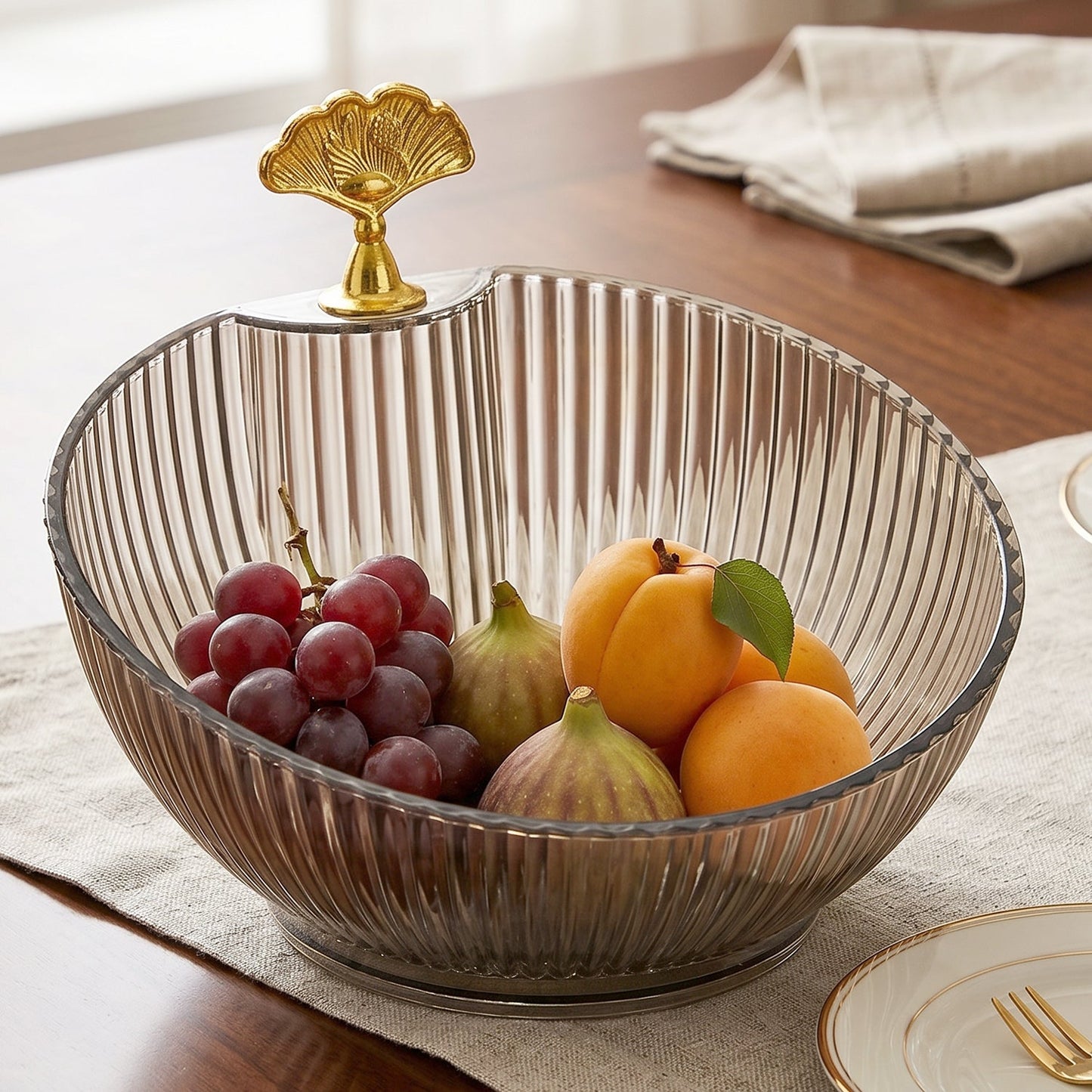 Serving fruit and snacks with decorative bowl on dining table