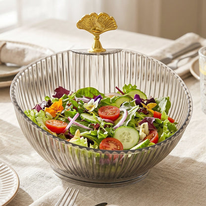 Fruit bowl with gold accent enhancing dining decor with fresh fruits