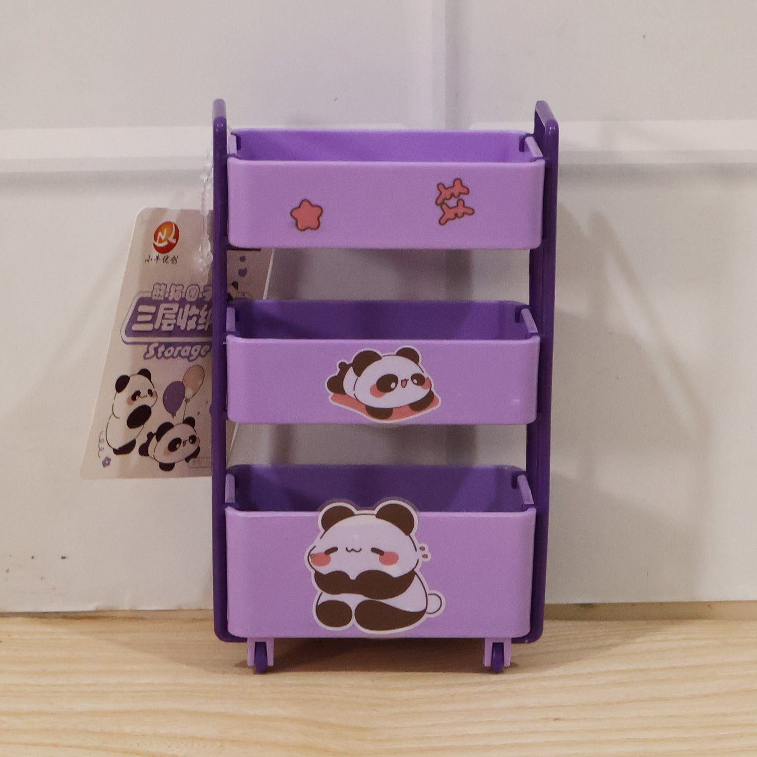 Mini storage trolley used to organize cosmetics on a dressing table.
