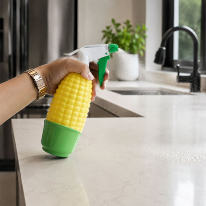 Decorative corn-shaped spray bottle used for watering indoor plants.