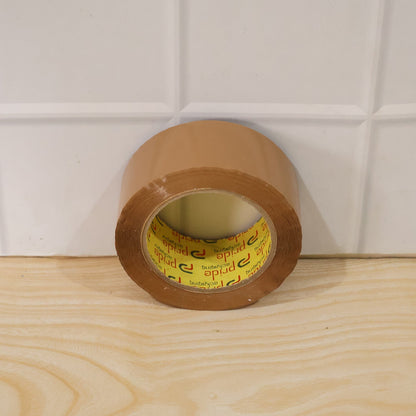Brown packing tape being used for sealing boxes