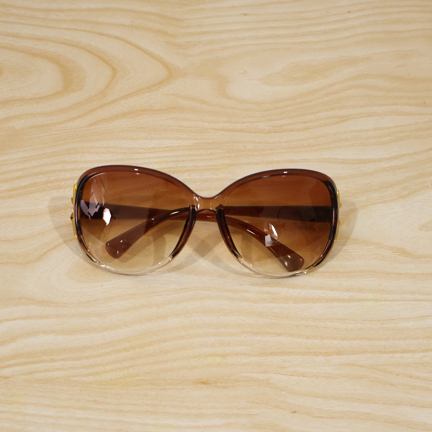 Detailed view of oversized sunglasses' frame and temple design.