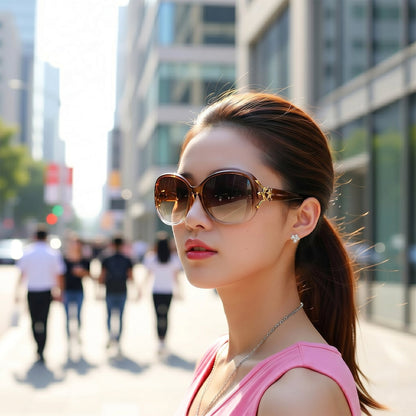 Chic woman posing in oversized sunglasses with gold detail.