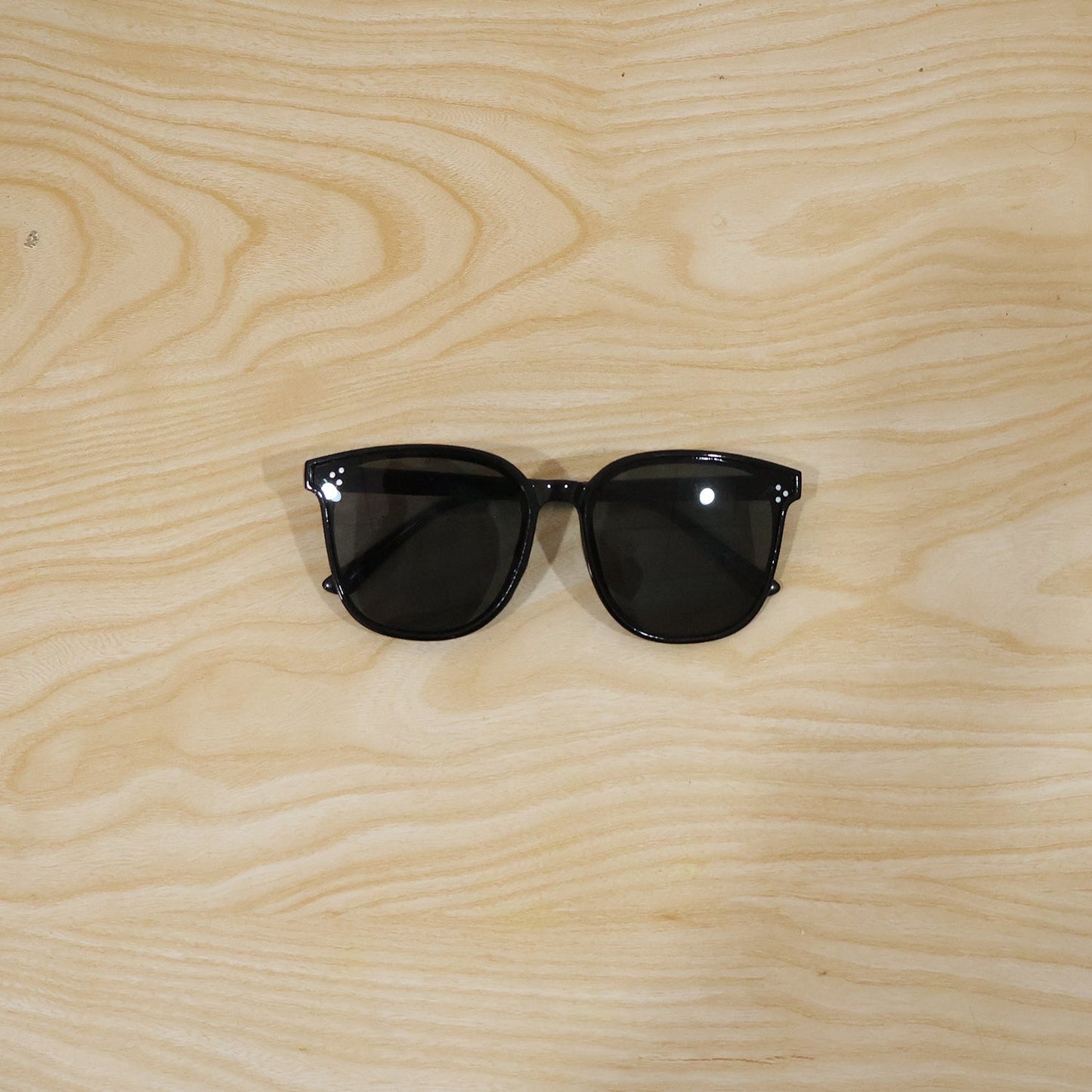 Close-up of stylish black sunglasses showing detailed design