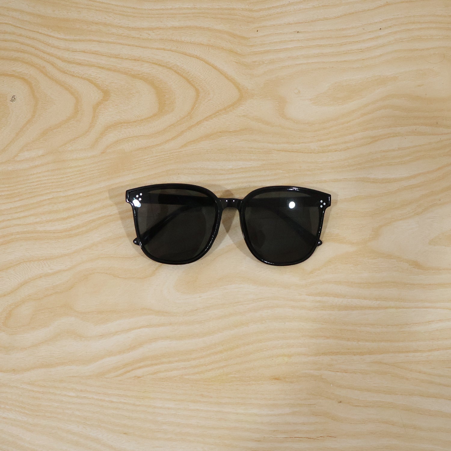 Close-up of stylish black sunglasses showing detailed design