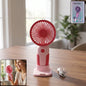 Mini rechargeable handheld fan in use, portable personal cooling device
