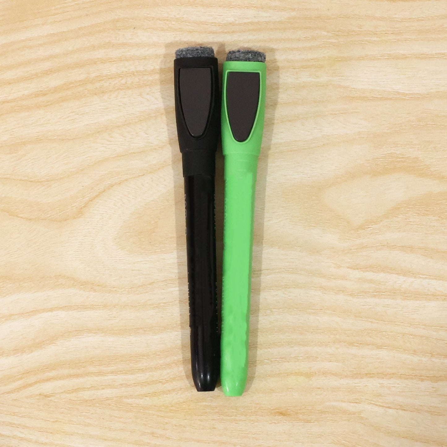 Person holding a dry erase marker for office or school use.