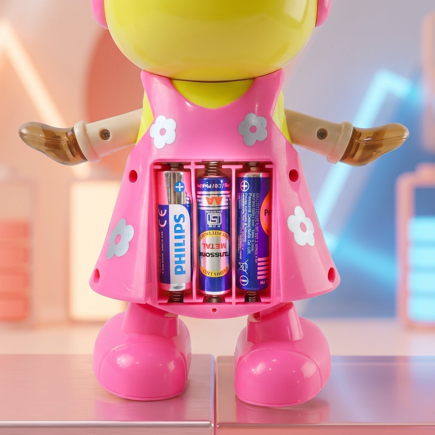 Close-up of flashing lights and moving parts on dancing girl toy