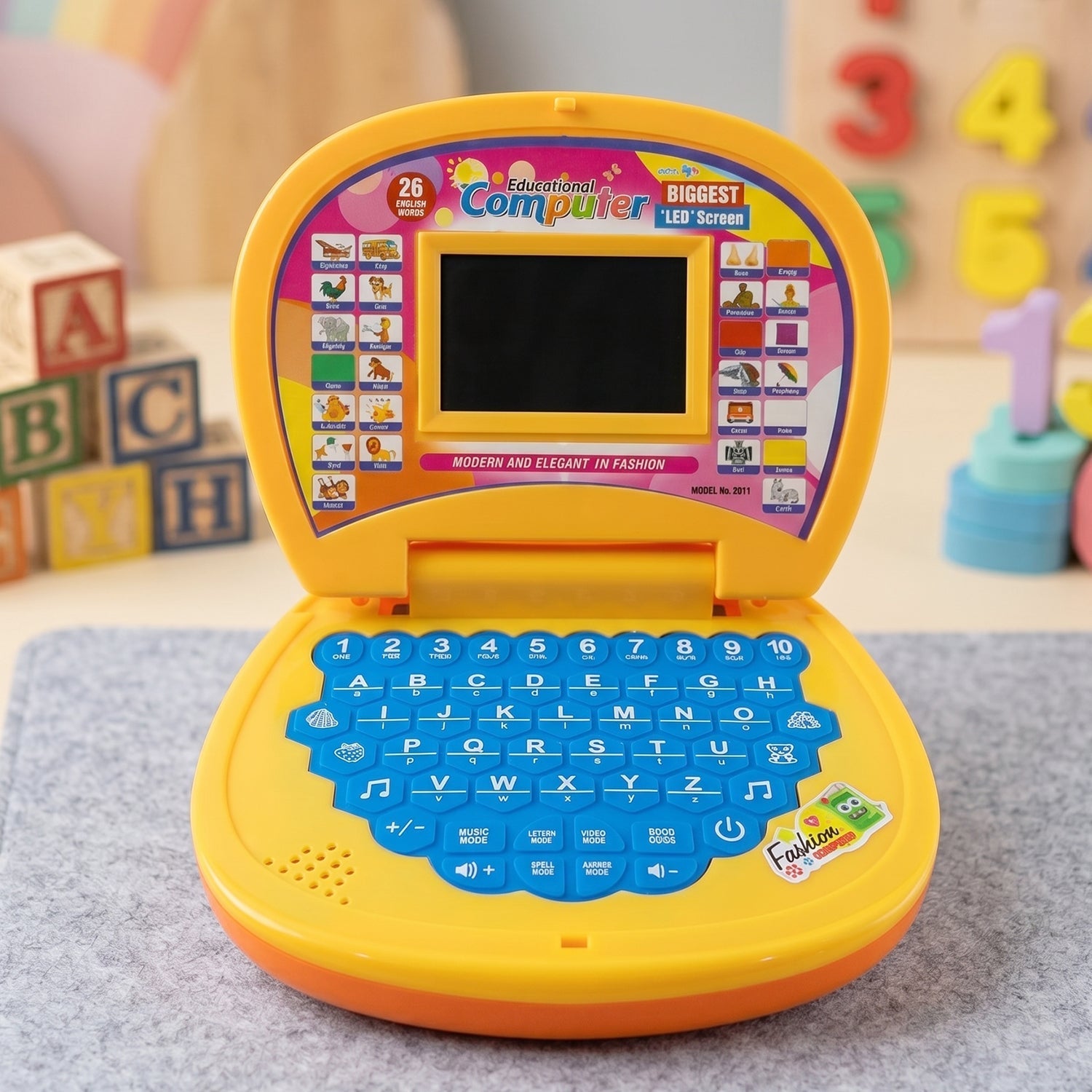 Kids laptop toy showing numbers, alphabets and colorful interface