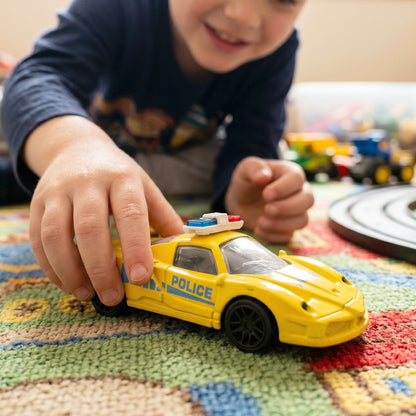 Friction toy car being played by children