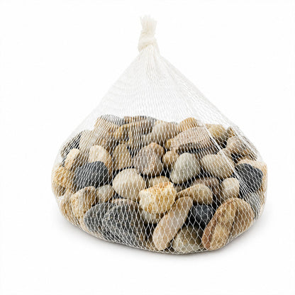 Assorted decorative pebbles scattered on a clean surface for display.