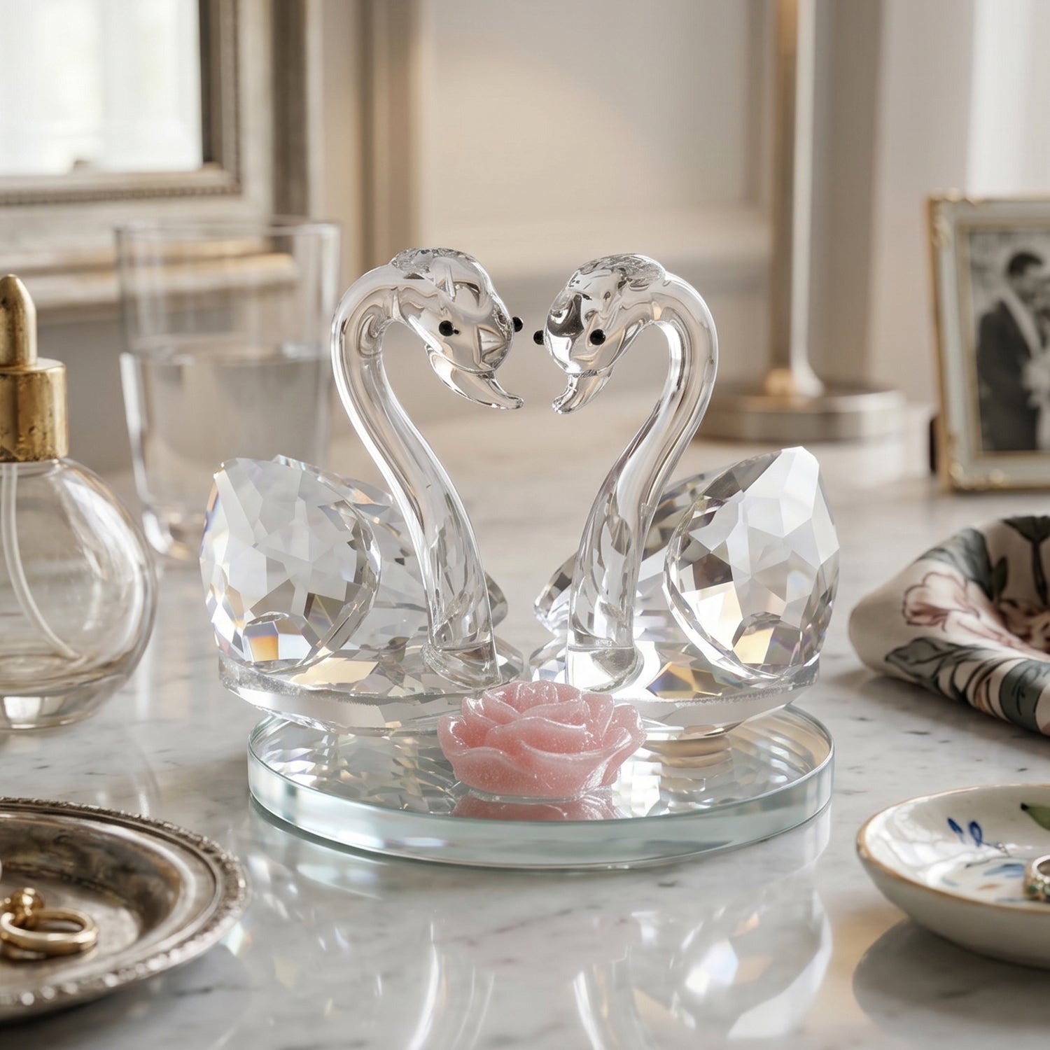 Close-up of faceted crystal swan pair reflecting light