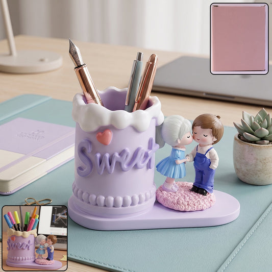 Resin sweet couple pen holder on desk with pens