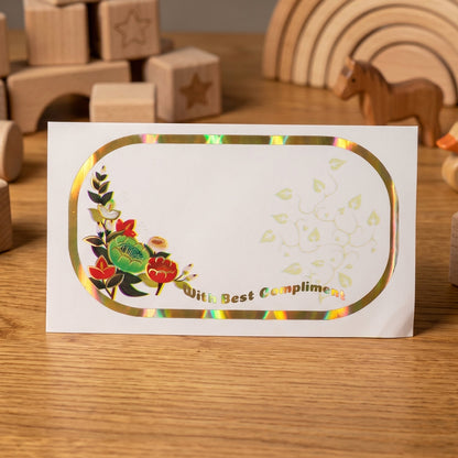 Close-up of floral foil gift stickers with writable space