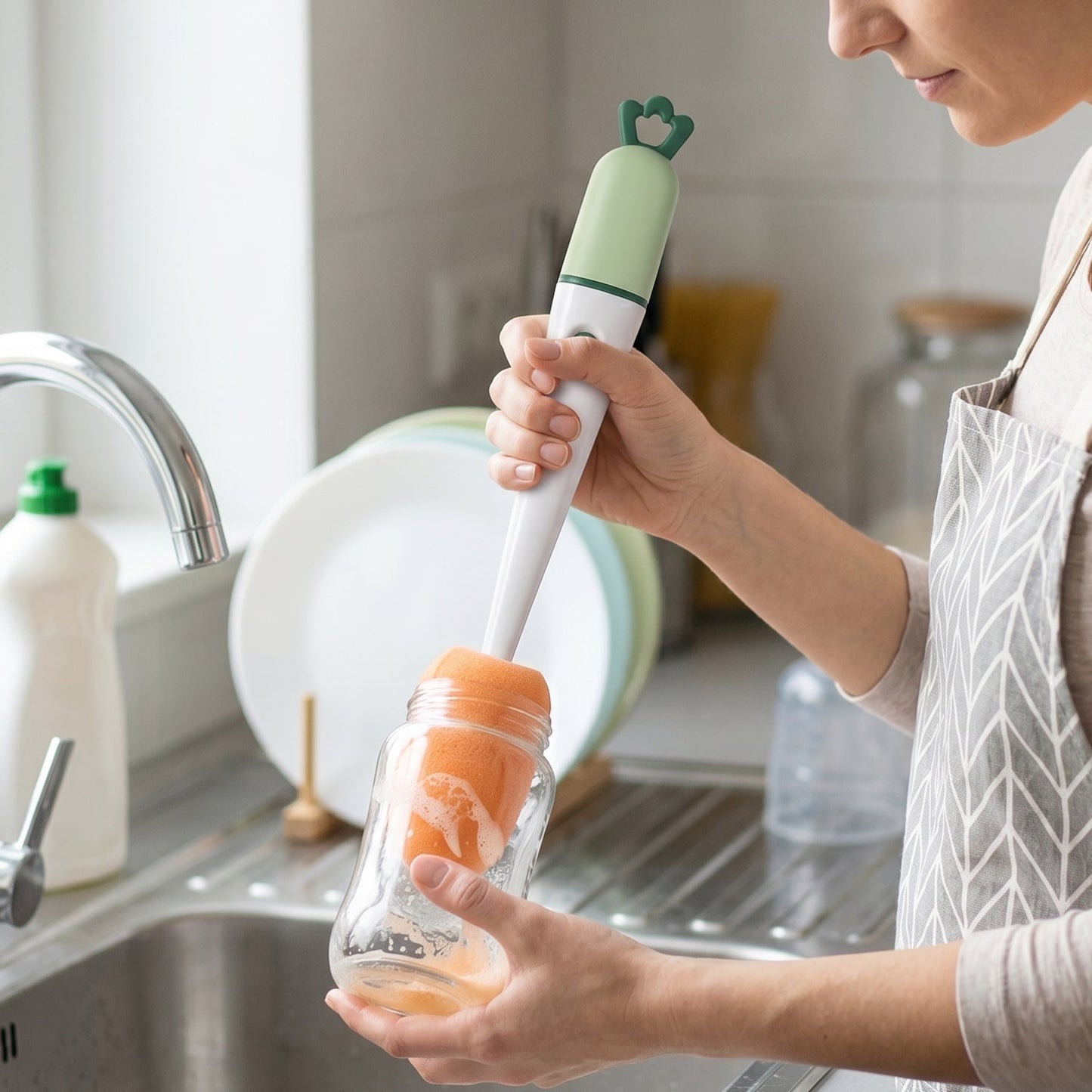 Using the brush for bottle cleaning in kitchen