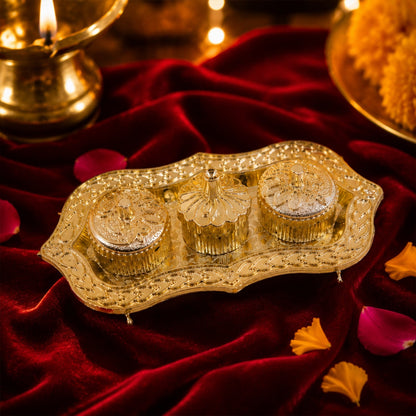 Close-up of the ornate golden Kankavati for puja rituals.