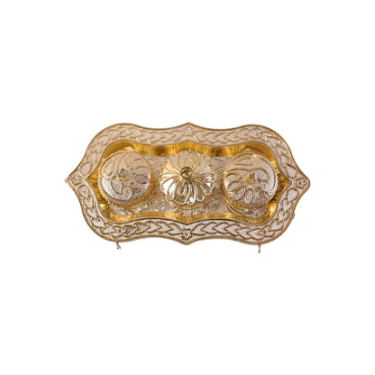Studio shot of the golden Kankavati on a white background.