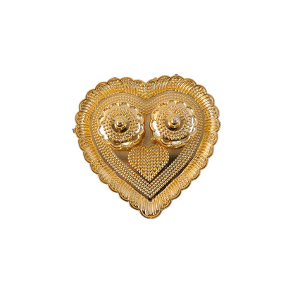 Kumkum holder with white background highlighting golden design