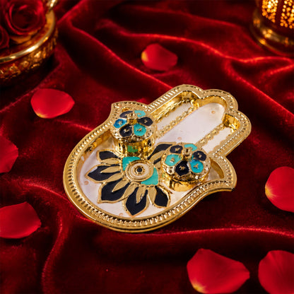 View of the hand-shaped kankavati with decorative enamel work