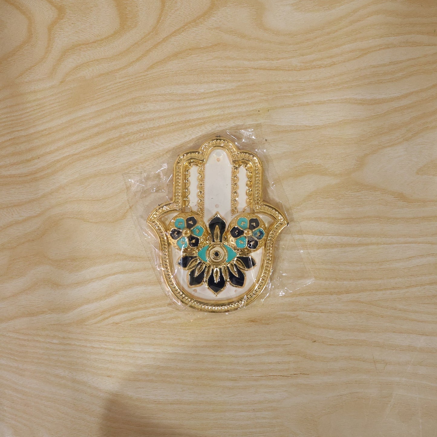 Packaged hand-shaped kumkum holder ready for gifting