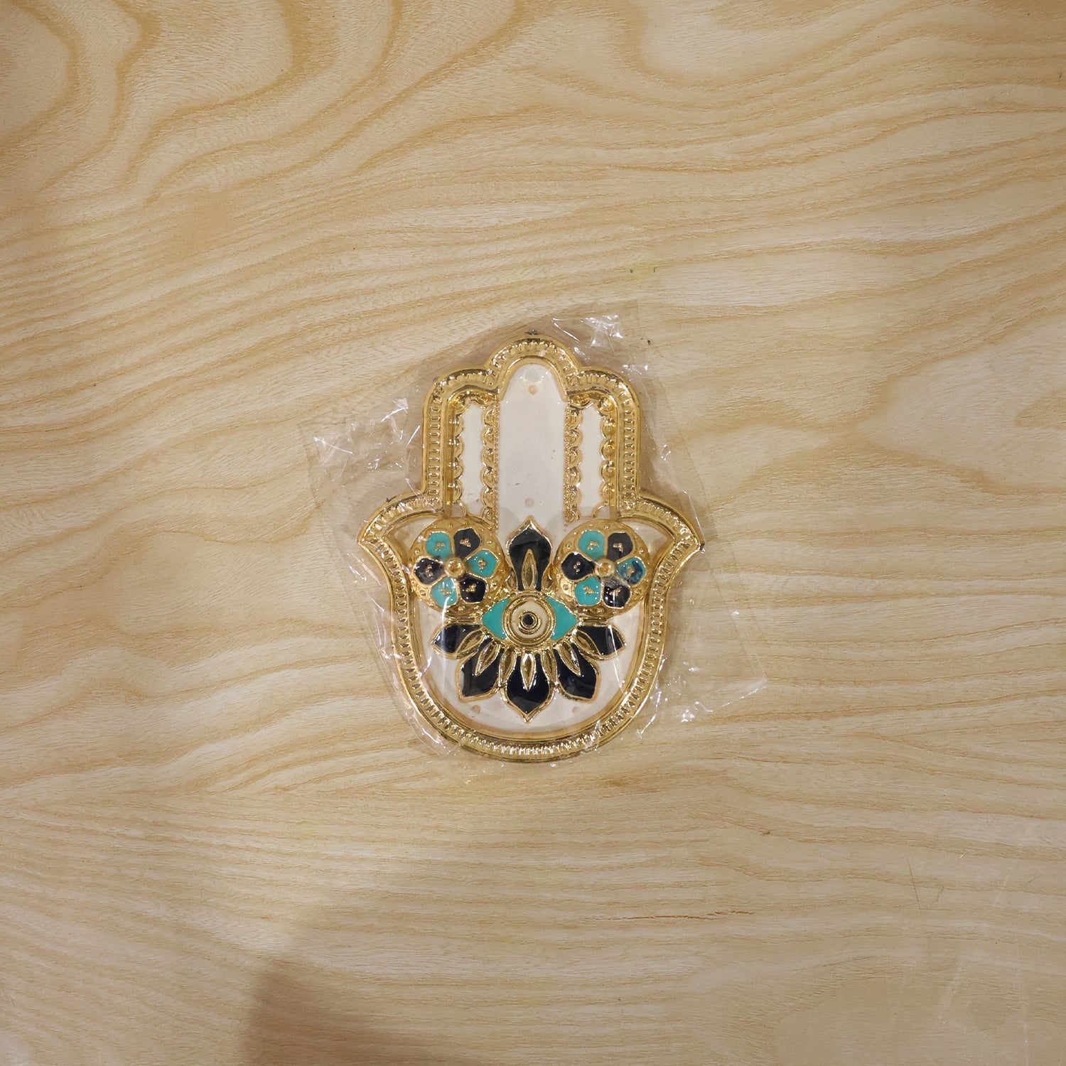 Packaged hand-shaped kumkum holder ready for gifting